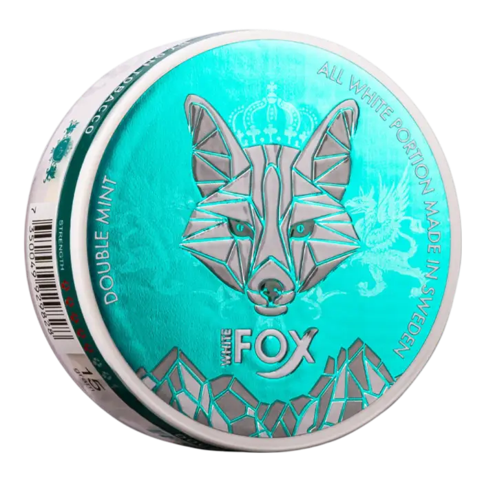 A teal and silver round container labeled White Fox with a stylised fox design. Text reads Double Min”t, All White Portion “Made in Sweden”.