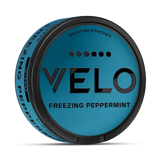 Close-up of a VELO nicotine pouch container labeled Freezing Peppermint with a blue and black design.