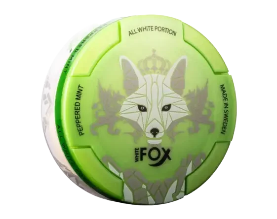 A green and white round container labeled "White Fox" with a stylised fox design. Text reads "Peppered Mint, All White Portion Made in Sweden”.