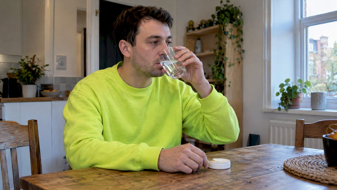 Adult resting with water after pouch nausea