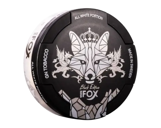 Round black can of "White Fox Black Edition" all white portion snus. Features a stylised fox with a crown and decorative elements. Text includes "GN Tobacco" and "Made in Sweden.